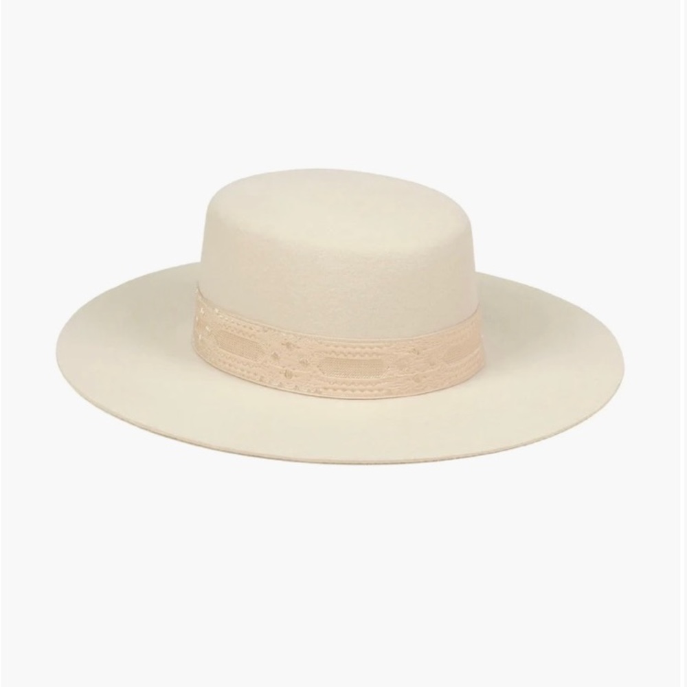 Lack of Color, wide-brimmed boater style. With a gold patterned vintage ribbon,